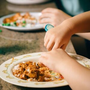 Image of child eating curry