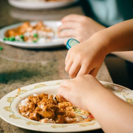 Image of child eating curry